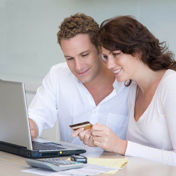 Couple completing healthcare purchase